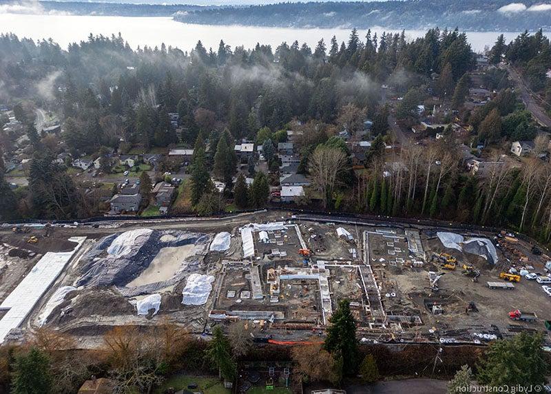 aerial of part of a large construction site with concrete footings showing where the building will be